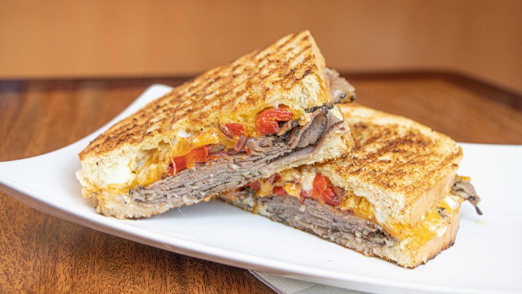 Roast Beef · Roast beef, grilled onions, roasted bell peppers, cheddar, dijon mustard and mayo.