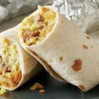 Breakfast Burrito · Meat, bacon or chorizo, eggs, fríes, cheese, sour cream and home made salsa.