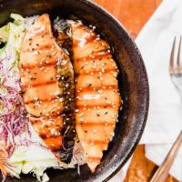 Salmon · Served with salad over rice.