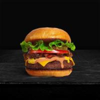 Classic Basic Burger · American beef patty topped with lettuce, tomato, onion, and pickles. Served on a warm bun.