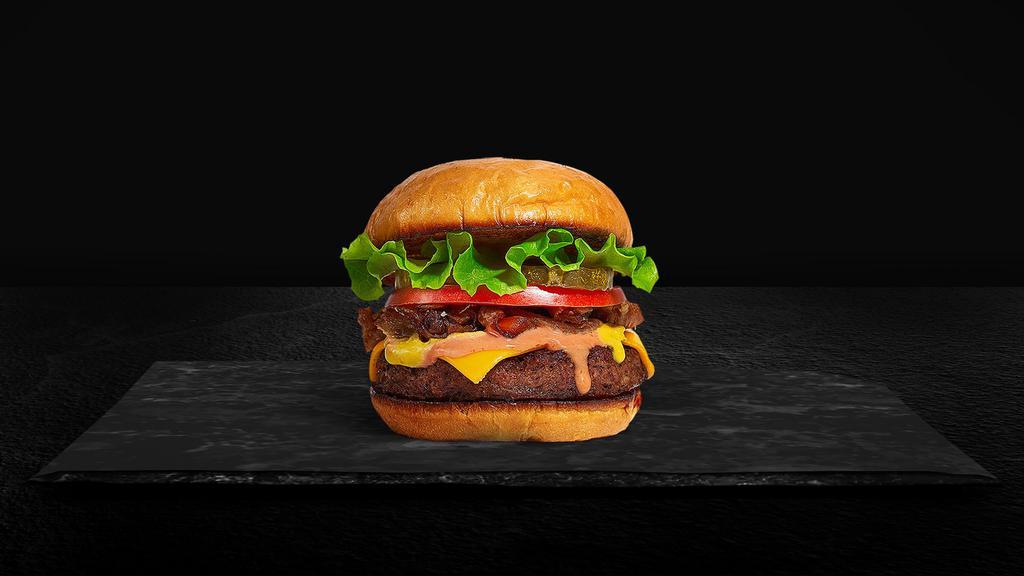 Classic Basic Burger · American beef patty topped with lettuce, tomato, onion, and pickles. Served on a warm bun.