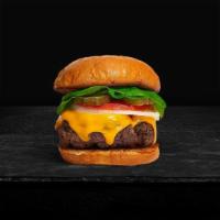 Cheese With Ease Burger · American beef patty topped with melted cheese, lettuce, tomato, onion, and pickles. Served o...