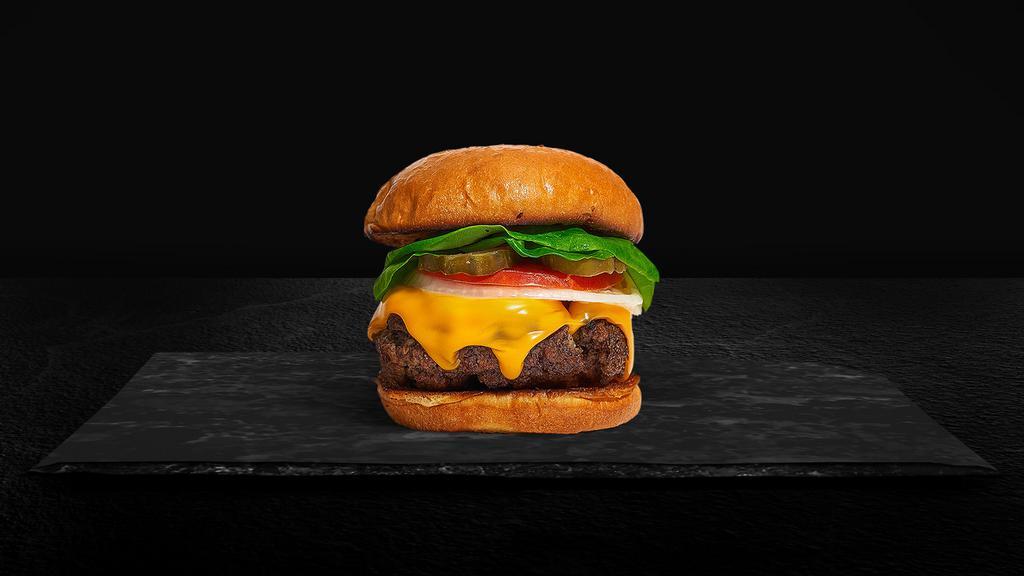 Cheese With Ease Burger · American beef patty topped with melted cheese, lettuce, tomato, onion, and pickles. Served on a warm bun.