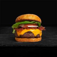 Bacon Beacon Burger · American beef patty topped with melted cheese, layers of crispy bacon, lettuce, tomato, onio...