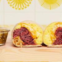 New York Breakfast Burrito · Two scrambled eggs, Mini Hash Browns, pastrami, caramelized onions, and melted cheese wrappe...