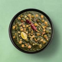 Garbanzo Beans & Spinach · Chickpeas and puréed spinach cooked in juicy onions, tomatoes, and perfectly grounded spices.