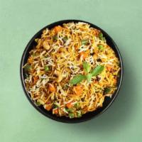 Village Veg Biryani · Long grain aromatic basmati rice simmered in aromatic Indian spices and layered with seasona...