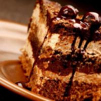 Chocolate Temptation · Layer of chocolate cake made with cocoa from Ecuador, filled with chocolate and hazelnut cre...