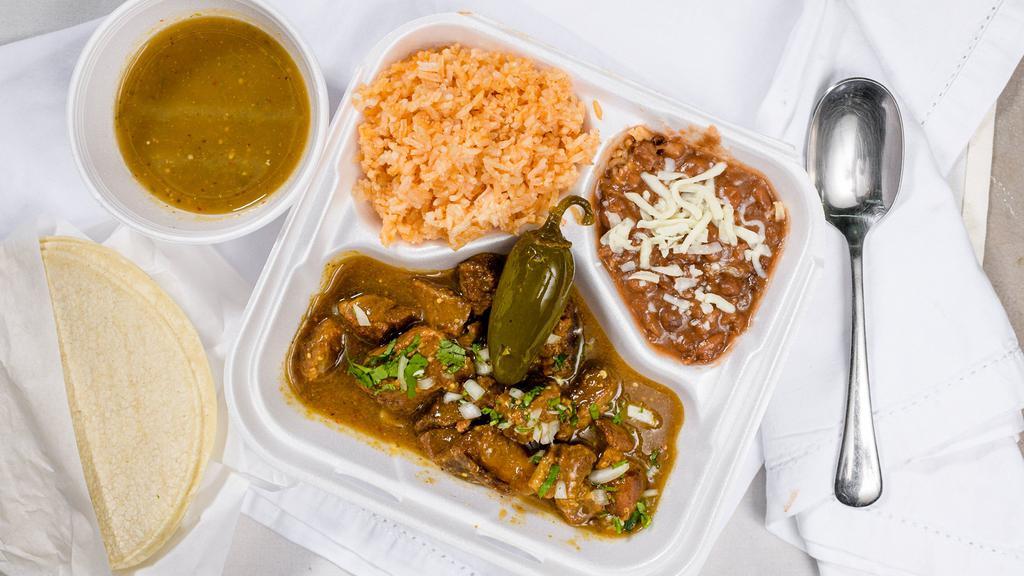 Pork with green sauce · Pork in green sauce with rice and beans