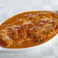 Butter Chicken · A special chicken cooked with creamy sauce made with butter, tomatoes and onions.