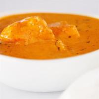 Chicken Tikka Masala · Tender chicken breast marinated with sauce and herbs cooked in creamy sauce.