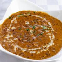 Dal Makhni Masala · Black lentil cooked to perfection with chef's special sauces.