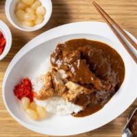 Karaage Curry · Three (3) pieces of our original, marinated chicken karaage served with curry, rice, and pic...