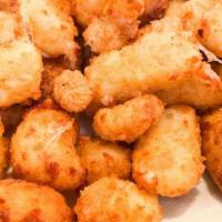 Sully’s Cheese Curds · Wisconsin's own Ellsworth Cooperative Creamery white cheddar cheese curds, beer-battered and...