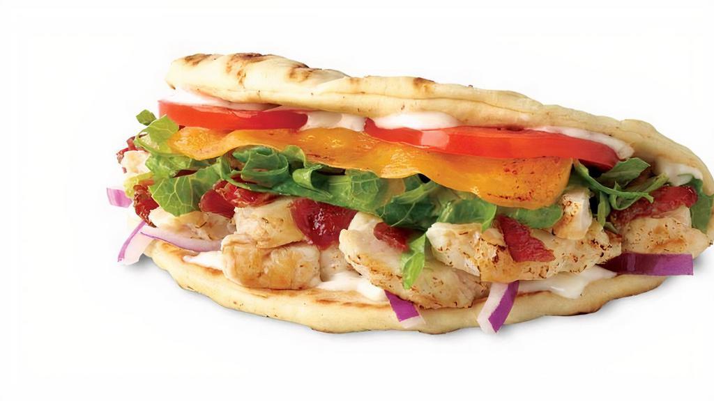 Mesquite Chicken Sammie · Chicken, bacon, cheddar, lettuce, tomatoes, onions, ranch on a flatbread. 410 cal.
