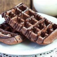 Chocolate Craze Waffle · Rolled ice cream topped with cocoa, fudge, chocolate sauce, and chocolate bar. Served with a...