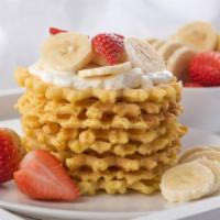 Banana Split Waffle · Rolled ice cream topped with fresh bananas, strawberries and fudge. Served with a choice of ...
