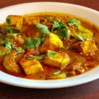 Karahi Paneer · Cheese cubes cooked with ginger, garlic, onion & bell peppers and a special blend of spices.