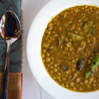 Daal · Vegan. Yellow lentil cooked with ginger, garlic & spices.