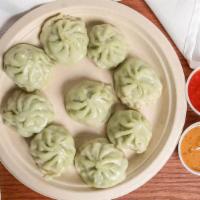 Vegetable Momos (10 Pc) · Seasonal vegetables minced to perfection and steamed into juicy dumplings.