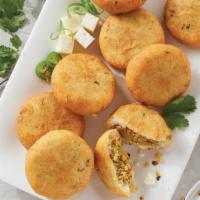 Aloo Tikki (2 pieces) with Chutneys · 2 Potato patties comes with Mint & Tamarind chutneys.