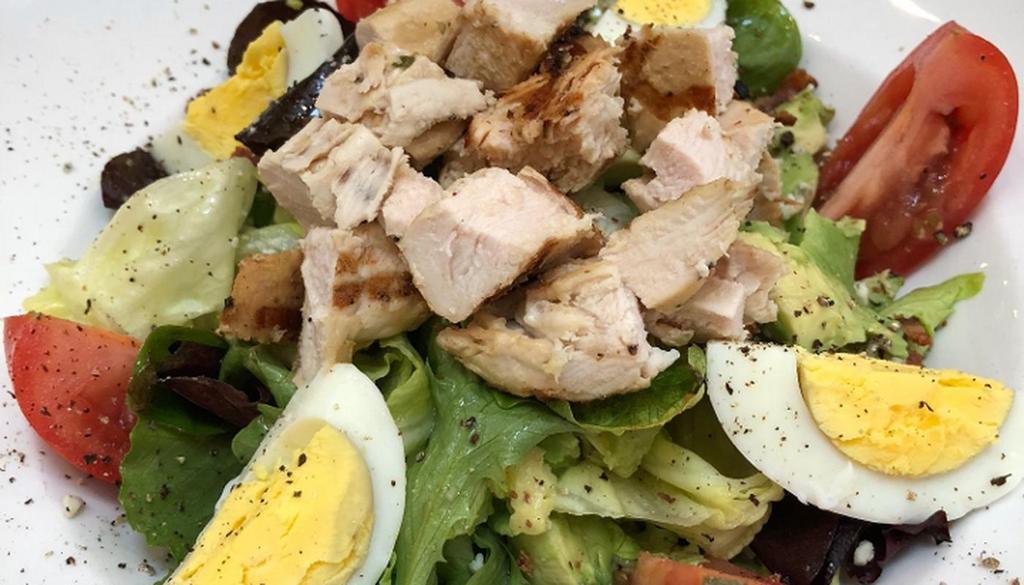 Cobb Salad. · grilled chicken, mixed greens, bacon, tomato, avocado, hard boiled egg, blue cheese crumbles, house vinaigrette