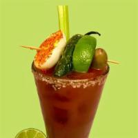 Virgin E&M Signature Bloody Mary · Hard boiled egg with tajin chili-lime seasoning, grilled jalapeño, lime, and olives.   Just ...