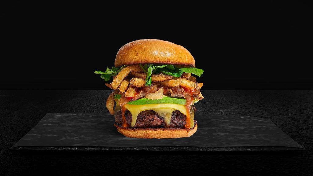Get Frenched Burger · American beef patty topped with fries, avocado, caramelized onions, ketchup, lettuce, tomato, onion, and pickles. Served on a warm bun.