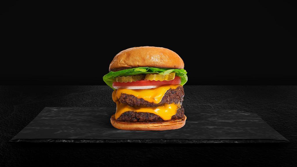 Double Cheesin' Cheese Burger · Two American beef patties topped with melted cheese, lettuce, tomato, onion, and pickles. Served on a warm bun.