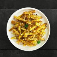 Garlic Parm Farm Fries · Idaho potato fries cooked until golden brown and garnished with garlic, salt, and parmesan c...