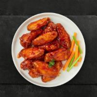 Buffed Up Buffalo Wings · Fresh chicken wings breaded, fried until golden brown, and tossed in buffalo sauce. Served w...
