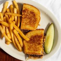 Patty Melt · 1/2 pound hamburger party between two slices of melted cheese served on grilled rye bread wi...