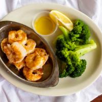 Shrimp Scampi · Sautéed with garlic butter, served with broccoli spears and topped with hollandaise sauce.