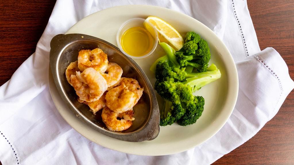 Scampi · Gulf shrimp sauteed in rich sauce of lemon butter, garlic, chopped parsley & fresh mushrooms.