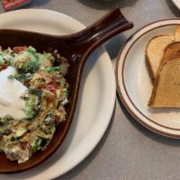 Veggie Skillet · Mushrooms, Spinach, Broccoli, Tomatoes, Onions, Scrambled Egg Whites and Sour Cream over Cou...