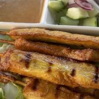 A07. Chicken Satay · Grilled chicken on skewers marinated with Thai spices served with peanut sauce and cucumber ...