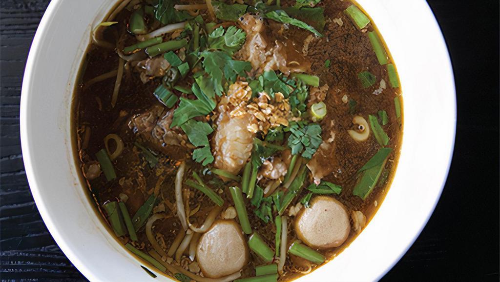 B04. Combination Beef Noodle Soup · sliced beef, beef balls, beef stew, Chinese broccoli and bean sprout in spicy beef broth.