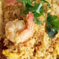 E04. Pineapple Fried Rice · Thai style fried rice with chicken, egg, shrimps, pineapple, raisin, white onion, green onio...
