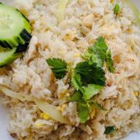 E03. Crab Meat Fried Rice · Fried rice with white crab meat, egg, white onion, and green onion topped with cilantro and ...