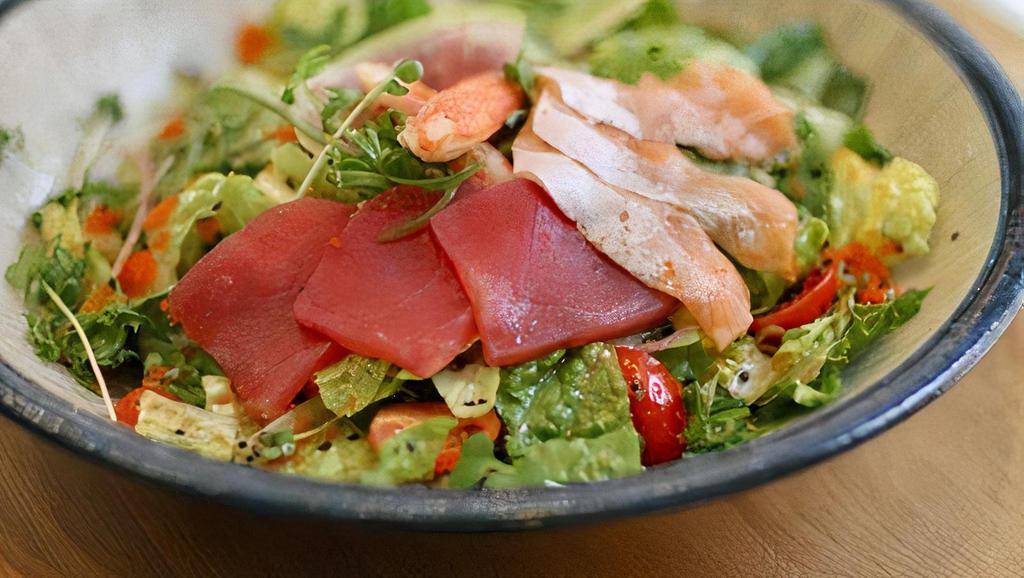 Sashimi Salad · Mixed greens, assorted sashimi, cucumber, tomato, sesame seeds, and ginger soy dressing.