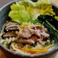 Niku Udon · Thinly sliced ribeye beef, napa, and bok choy. Green onion, tempura flakes, and in dashi bro...