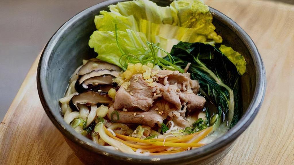 Niku Udon · Thinly sliced ribeye beef, napa, and bok choy. Green onion, tempura flakes, and in dashi broth.