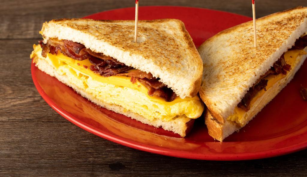 Breakfast Sandwich · Choice of bacon, sausage, ham or chorizo with cheese & egg served on toast. croissant is EXTRA..... $2.25