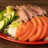 Fresh Blackened Ahi Salad · Choice of seared ahi (blackened) romaine, shredded carrots, cucumbers, edamame, balsamic dre...