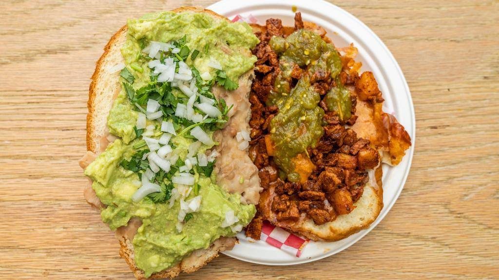 Tortas · A torta is a kind of sandwich, served on a telera roll. With your choices of meat, onion, cilantro, and seared cheese, beans spread, finished with sauce &  guacamole.