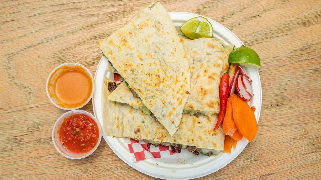 Quesadillas · Folded crisp flour tortilla, melted cheese, onions and cilantro and finished with guacamole. (Salsas on side)