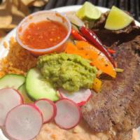 Carne Asada / Grilled Steak · Grilled carne asada plate served with rice and beans, with roasted jalapeños, grilled spring...