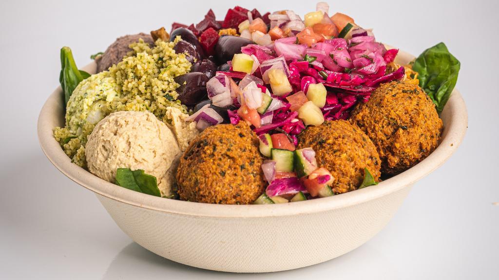 Classic Mediterranean Bowl · All the classic Mediterranean flavors made with couscous, Cucumber, Tomato, Red Onion, Mixed Greens, Olives, Traditional Hummus, Lemon Olive Oil, Traditional Tahini.