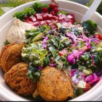 Falafel Salad · Nothing more satisfying than a traditional falafel salad, with mixed greens, olives, hummus,...