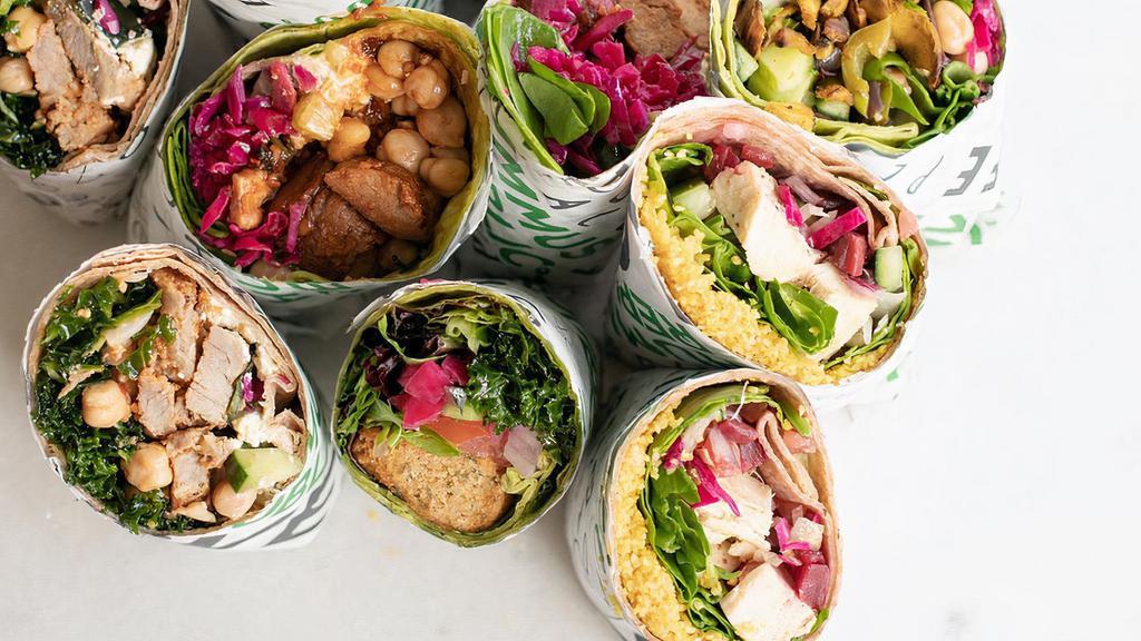 The Original Mediterranean Wrap · All the classic Mediterranean flavors inside your choice of a spinach or wheat wrap, filled with chopped salad, mixed greens, pickled onion, white cabbage, Hummus, Traditional Tahini.